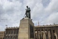 Closeup to a Simon Bolivar monument located at downtown simon bolivar square with presidential palace behind Royalty Free Stock Photo