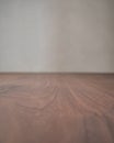 Closeup toned black walnut surface with white wall on background