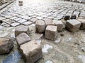 Closeup toned image of reconstruction and building of old cobblestone road Royalty Free Stock Photo