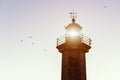 Closeup of the Top of a Lighthouse against sky