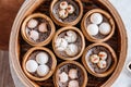 Closeup top view of Dim sum set: Barbecued pork bun, Shrimp dumpling, Sweet cream buns, Shrimp shumai topping with goji berry. Royalty Free Stock Photo