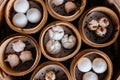 Closeup top view of Dim sum set: Barbecued pork bun, Shrimp dumpling, Sweet cream buns, Shrimp shumai topping with goji berry. Royalty Free Stock Photo