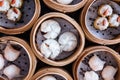 Closeup top view of Dim sum set: Barbecued pork bun, Shrimp dumpling, Sweet cream buns, Shrimp shumai topping with goji berry. Royalty Free Stock Photo