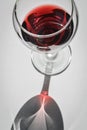 Closeup top view of a glass of red wine with shadows and reflections Royalty Free Stock Photo