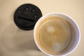 Closeup top view of one-off cup of coffee with foam Royalty Free Stock Photo