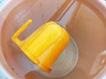 A closeup top view shot of orange water mug