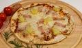 Closeup top view studio shot of round hot oven baked tasty delicious Italian homemade ham pineapple original Hawaiian soft bread Royalty Free Stock Photo