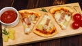 Closeup top view studio shot of three pieces of hot oven baked tasty delicious Italian homemade ham and pineapple Hawaiian soft Royalty Free Stock Photo