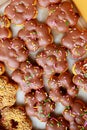 Closeup top view studio shot of various kinds of delicious tasty yummy baking donuts including strawberry chocolate white malt and