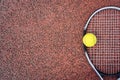 Closeup top view on tennis ball and racket racquet lying on acrylic tennis hard court surface with empty blank copy Royalty Free Stock Photo