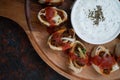 Closeup top view of Turkish Beyti kebab served with grilled vegetables and yogurt sauce on wooden table Royalty Free Stock Photo