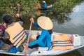 Closeup tourism rowing boat in cajuput forest in floating water season in Mekong delta, Vietnam