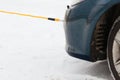 Closeup of towed car with towing rope