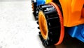 Closeup of a toy car wheel on floor Royalty Free Stock Photo