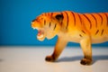 Closeup of a toy figurine of a roaring tiger