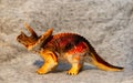 Closeup of a toy figurine of a triceratops dinosaur