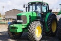 Closeup of tractor after plowing. Wheels covered with mud. Agro