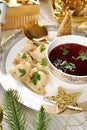 Closeup of traditional Christmas Eve red borscht with dumplings filled with mushrooms and sauerkraut Royalty Free Stock Photo