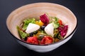 Closeup traditional greek salad with fresh vegetables, feta cheese, olives and olive oil in a bowl. Top view. Rustic style. Royalty Free Stock Photo