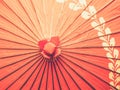 Closeup of a traditional Japanese red Wagasa umbrella with a golden pattern Royalty Free Stock Photo