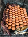 Closeup Traditional Thailand Street Food: Grilled/Roasted chicken eggs, sweet taros, mackerel fish and corn on the stove