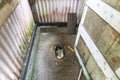 Closeup traditional toilet hole on ground. Faeces droppings into river Royalty Free Stock Photo