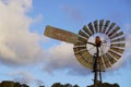 Closeup of a traditional windmill in a picturesque landscape on a sunny hillside