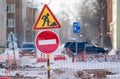 Closeup traffic stop sign, detour, repair, reconstruction of the road in the town