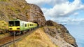 Closeup of train exiting a tunnel. View from Cliff Walk Bray to Greystones, Ireland Royalty Free Stock Photo