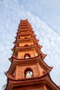 Closeup of the Tran Quoc Pagoda against a blue sky with whisky white clouds, Hanoi, Vietnam Royalty Free Stock Photo