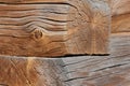 Closeup of transect of two square logs with coils and cracks lying on each other Royalty Free Stock Photo