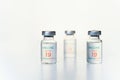 Closeup transparent vials with new vaccine for covid-19 coronavirus, flu, infectious diseases. Injection after clinical trials for