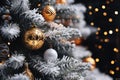 A Closeup of a Tree\'s Ornaments: Fancy Silver Dresses and Golden