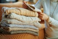 Closeup on trendy woman checking sweaters for damage