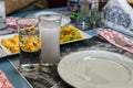 Closeup of Turkish raki and appetizers on table Royalty Free Stock Photo