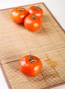 Closeup twig five red tomatoes Royalty Free Stock Photo