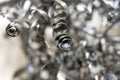 Closeup twisted spiral steel shavings. Drilling industry