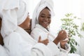 Closeup of two african women enjoying spa day Royalty Free Stock Photo