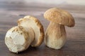 Closeup of two Agaricus bisporus dible mushroom on wooden surface Royalty Free Stock Photo