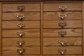 Closeup of two antique wooden pharmacist desk drawers