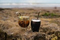 Closeup of two Argentinian yerba mate cups in golden and brown colors on an isolated background Royalty Free Stock Photo