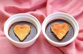 Two Chocolate Mousse Pastries Decorated with Heart Shaped Chiffon Cakes Royalty Free Stock Photo