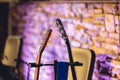 Closeup of two electric guitar headstocks.