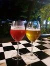 A closeup of two glasses of alcohol cocktails on a bar counter. Royalty Free Stock Photo