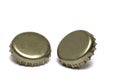 Closeup two golden crown corks slightly standing Royalty Free Stock Photo