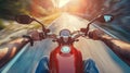 Closeup of two hands on motorcycle handlebars, motorcyclist on paved road