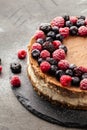 Two-layer cheesecake decorated with berries