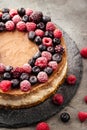 Two-layer cheesecake decorated with berries