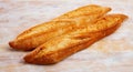 French loaves on wooden surface Royalty Free Stock Photo