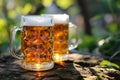 closeup two mugs of beer with foam on a stone on blurred green wood background